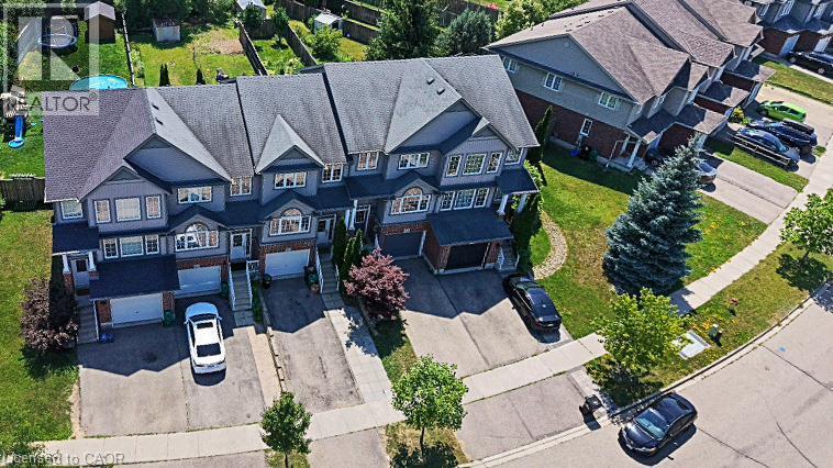 Contemporary townhomes featuring multi-story facades, attached garages, and individual driveways - 60 Featherstone Street, Kitchener, ON - Outdoor