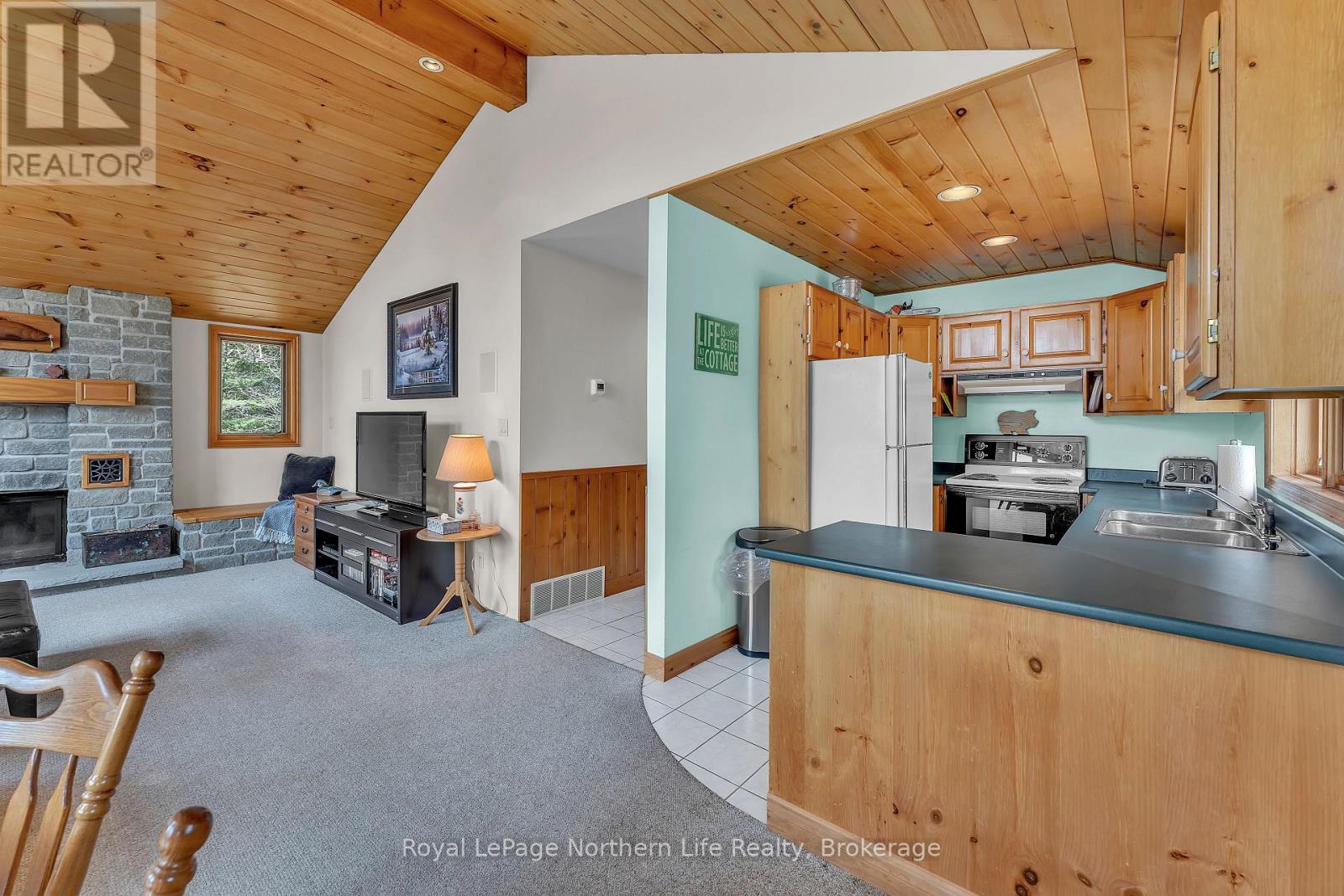 133 Harrison Road, Nipissing, ON - Indoor Photo Showing Kitchen With Fireplace