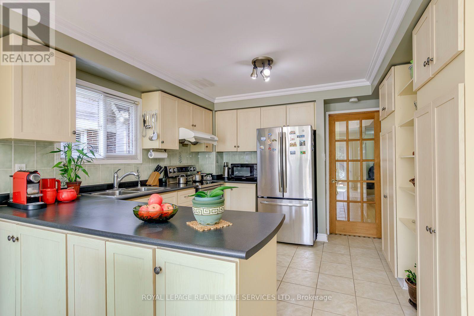 Kitchen Features Maple Wood Cabinetry and Pantry - 3364 Ingram Road, Mississauga, ON - Indoor Photo Showing Kitchen With Double Sink