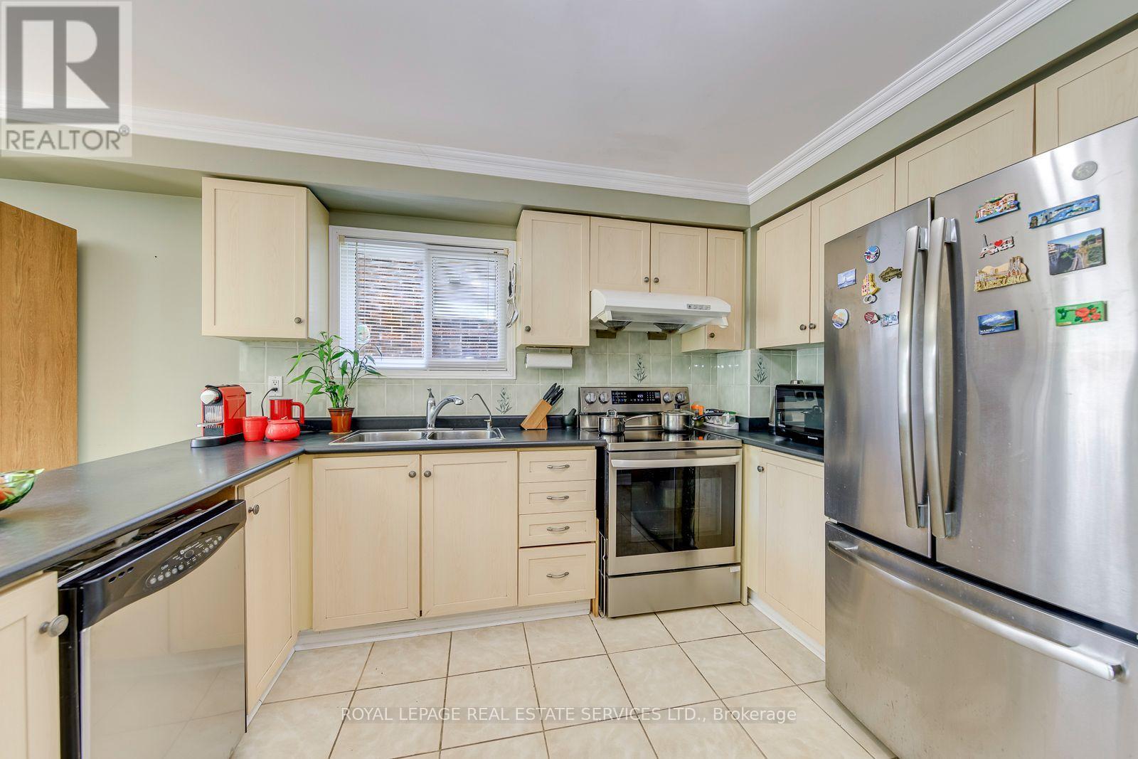 Stainless Steel Appliances and Crown Moulding - 3364 Ingram Road, Mississauga, ON - Indoor Photo Showing Kitchen With Double Sink