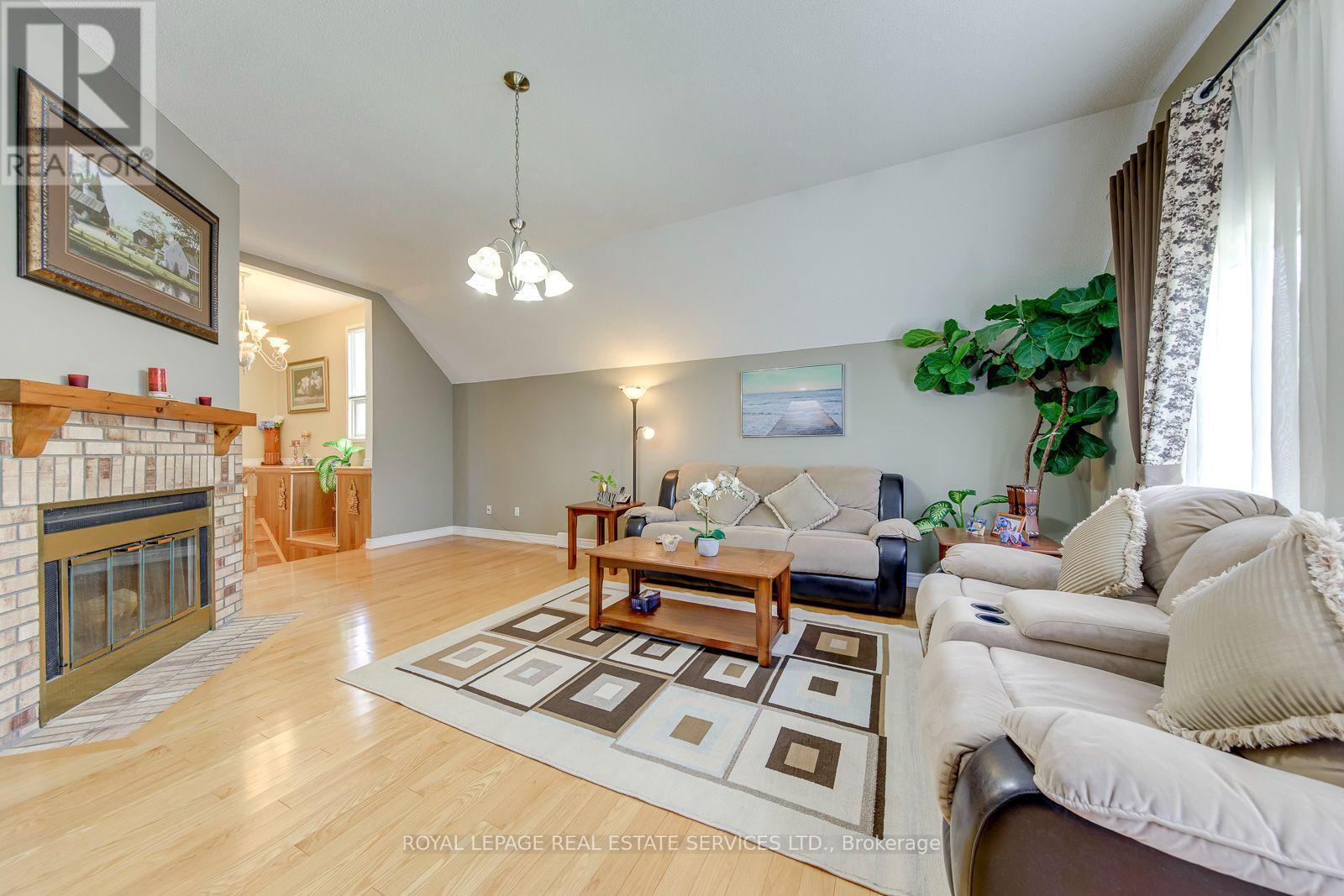 Perfect as Family Lounge, Kid's Playroom, Media Rm - 3364 Ingram Road, Mississauga, ON - Indoor Photo Showing Living Room With Fireplace