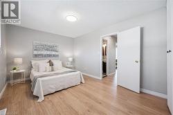 Neutral tone wall paint with wood-finish flooring - 