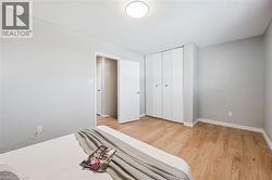 Light grey wall paint with a white baseboard trim - 