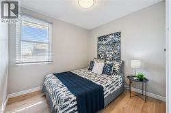 Neutral tone walls with light wood-finish flooring - 