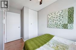 Light-colored walls complement wood-finish flooring - 