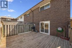 Expansive wooden deck with full privacy fencing - 
