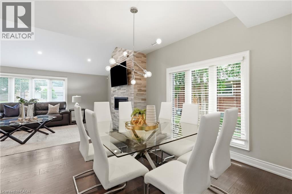 332 Woodworth Drive W, Ancaster, ON - Indoor Photo Showing Dining Room With Fireplace