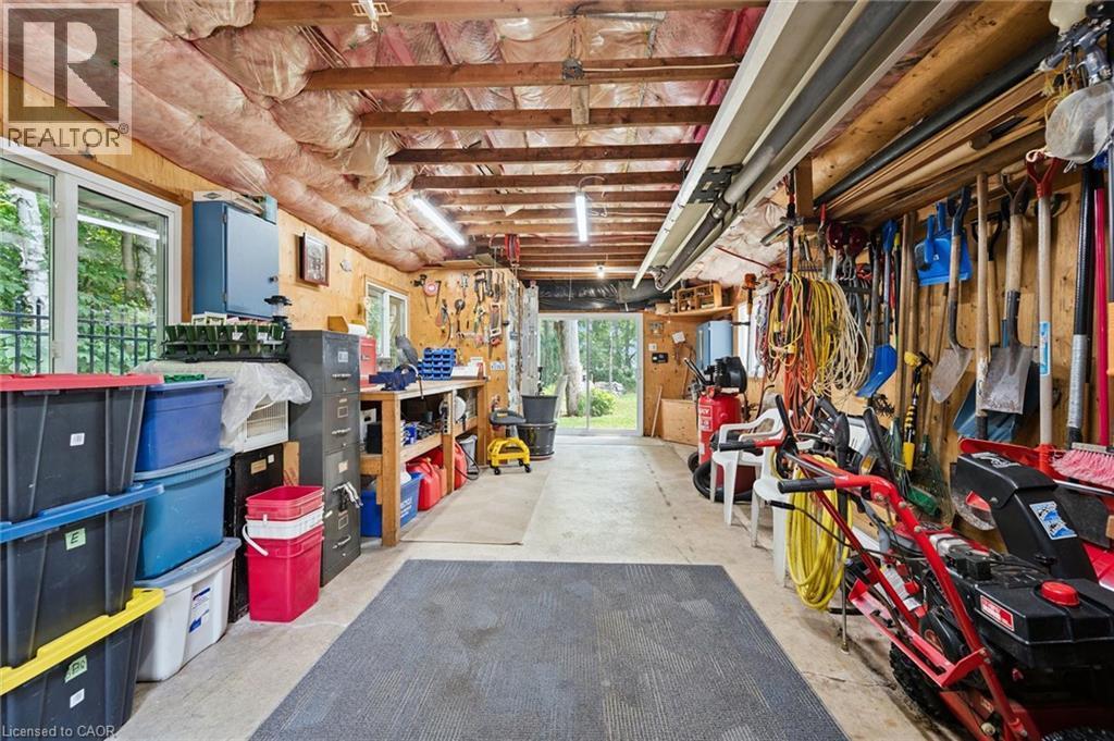 Insulated workshop with integrated IR tube natural gas heater with thermostat and LED lighting - 410 Avenue Road, Cambridge, ON - Indoor Photo Showing Basement