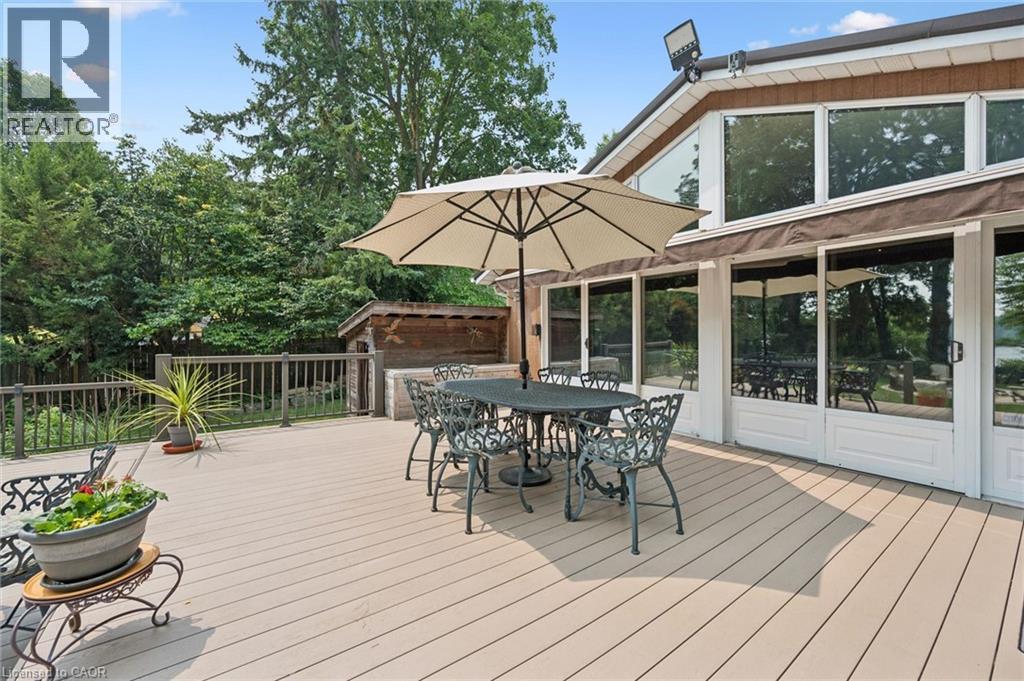 Expansive deck featuring light-toned composite decking, dark railings, natural gas connection for barbeque - 410 Avenue Road, Cambridge, ON - Outdoor With Deck Patio Veranda With Exterior