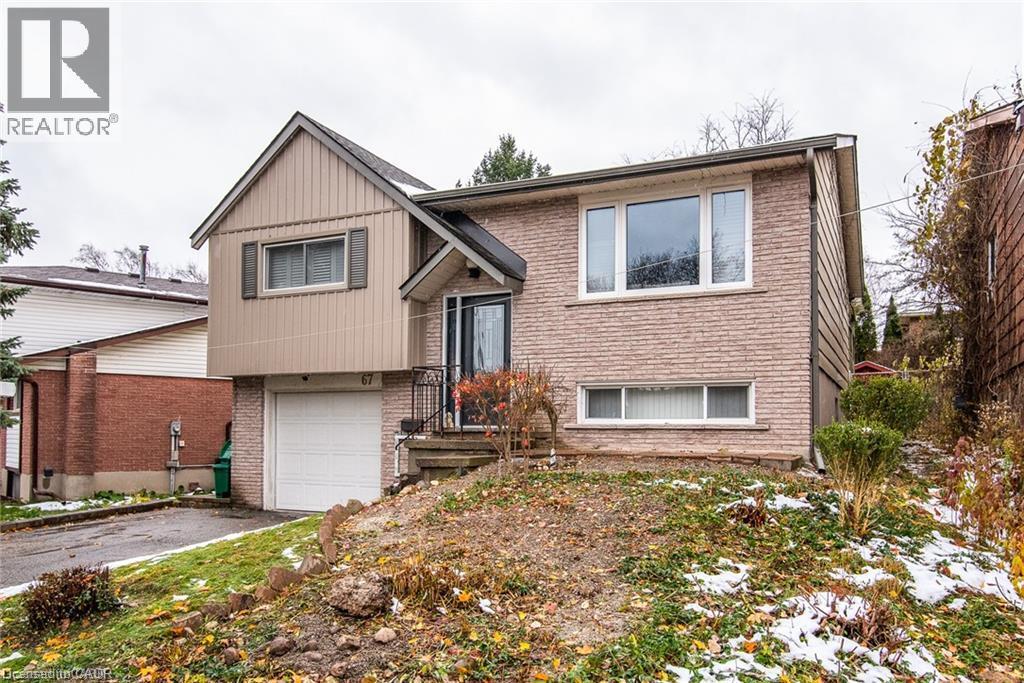 Split-level residence featuring a brick facade and vertical siding - 67 Pinemeadow Crescent, Waterloo, ON - Outdoor