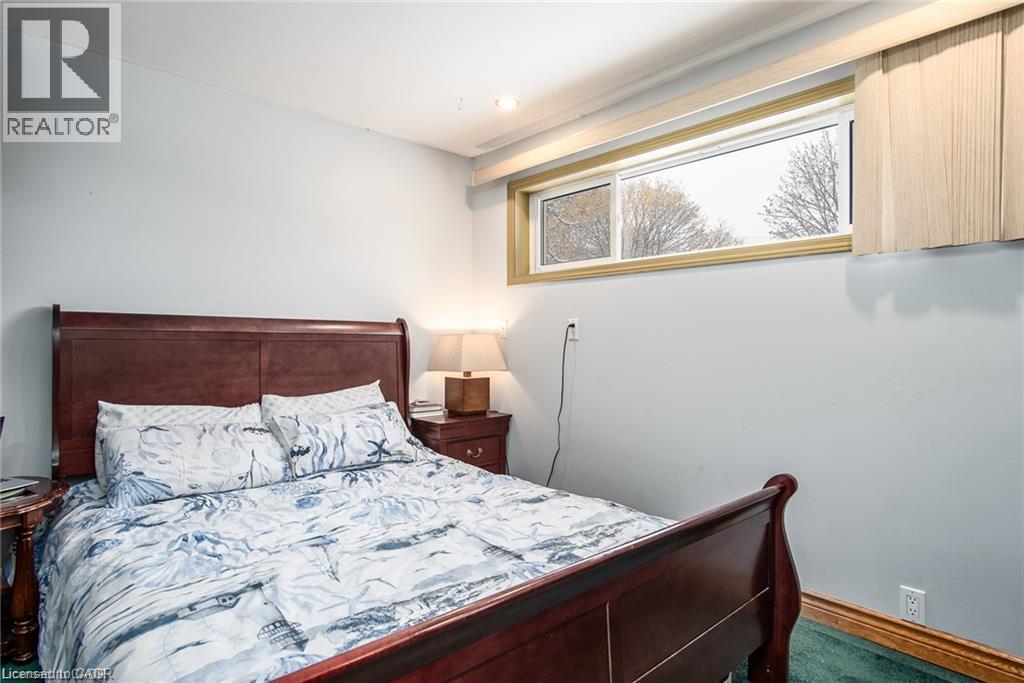 Recessed lighting illuminates neutral-toned walls - 67 Pinemeadow Crescent, Waterloo, ON - Indoor Photo Showing Bedroom