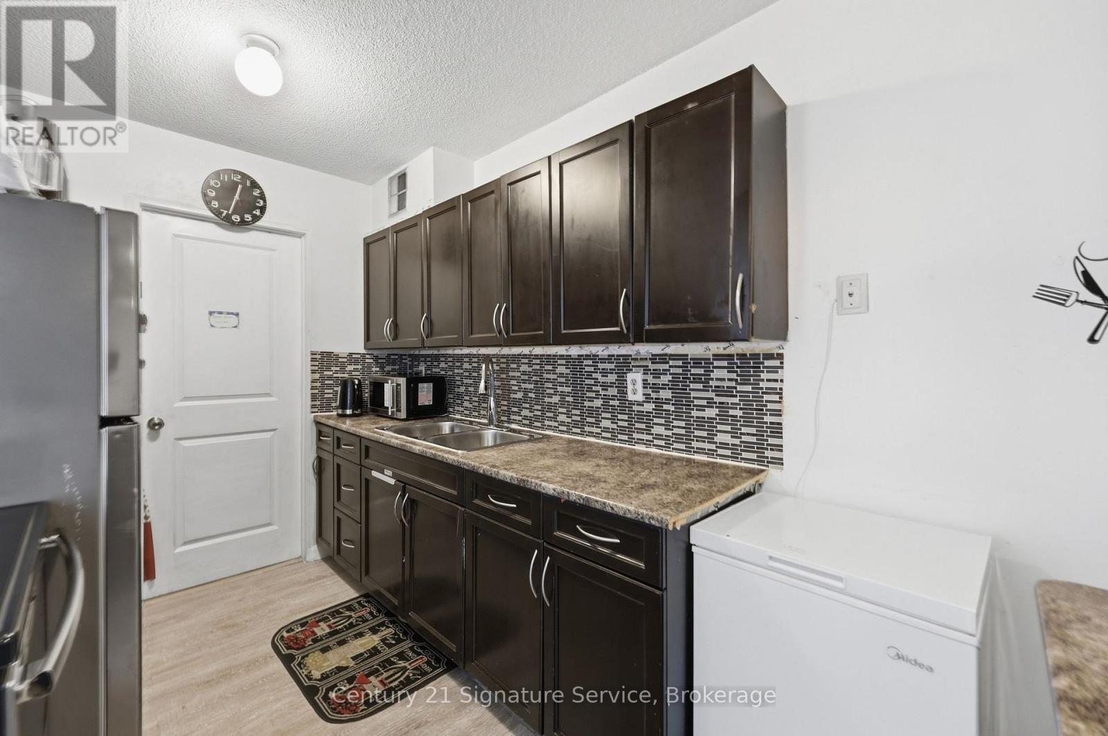 610 - 1250 Bridletowne Circle, Toronto, ON - Indoor Photo Showing Kitchen With Double Sink
