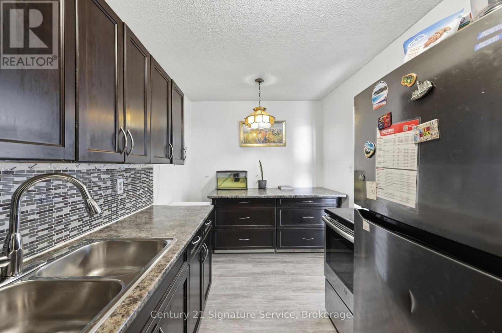 610 - 1250 Bridletowne Circle, Toronto, ON - Indoor Photo Showing Kitchen With Double Sink