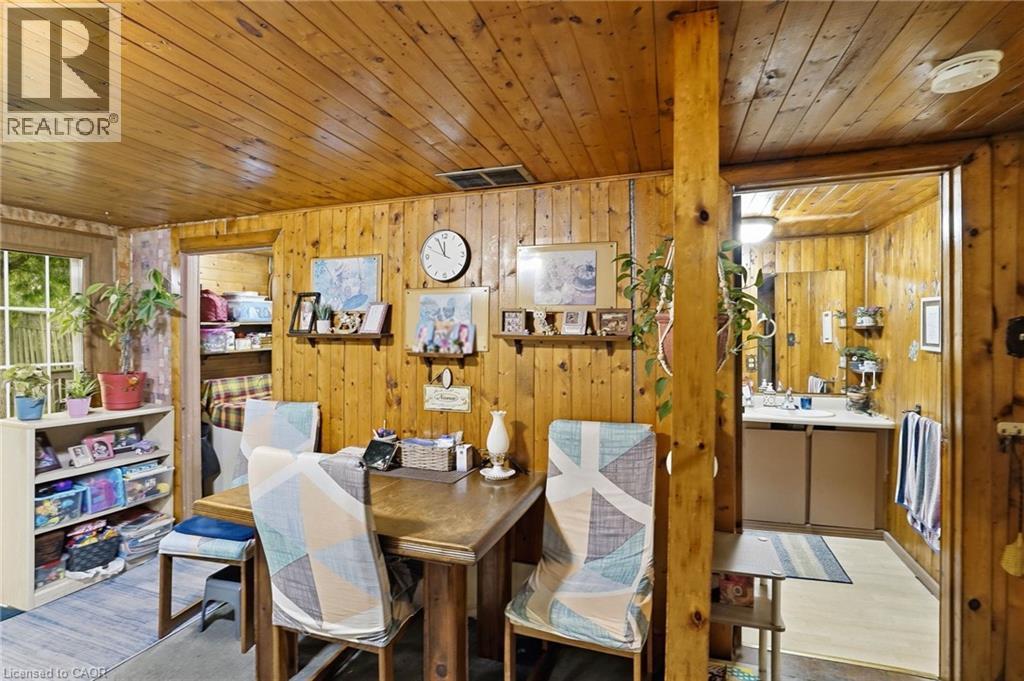 Interior space featuring wood-paneled walls and ceiling - 834 Mohawk Road E, Hamilton, ON - Indoor Photo Showing Dining Room