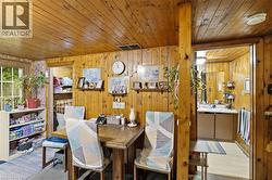 Interior space featuring wood-paneled walls and ceiling -