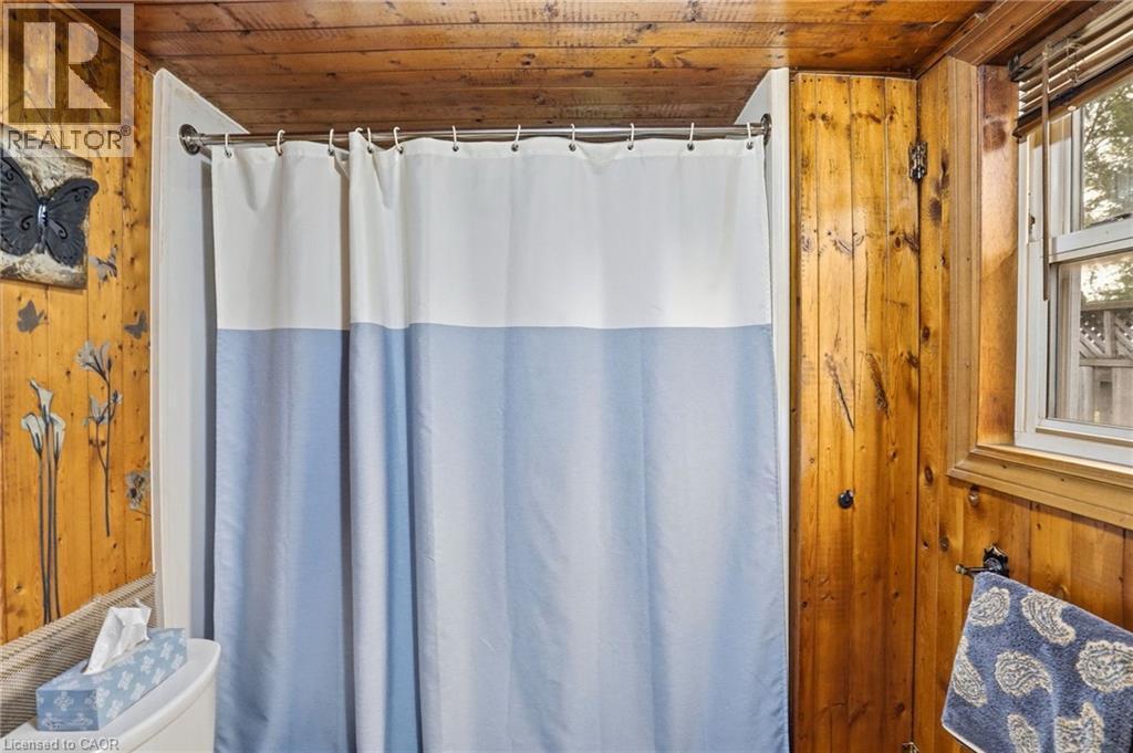 Bathroom featuring wood-paneled walls and ceiling - 834 Mohawk Road E, Hamilton, ON - Indoor Photo Showing Bathroom