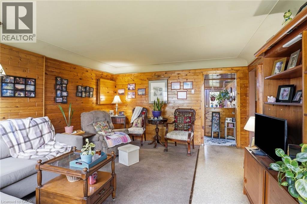 Living area with natural wood paneling - 834 Mohawk Road E, Hamilton, ON - Indoor Photo Showing Living Room