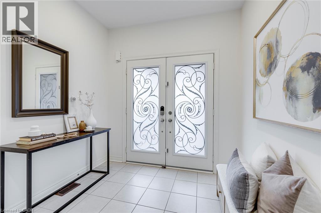 Double entry doors with ornate privacy glass - 598 Bessborough Drive, Milton, ON - Indoor Photo Showing Other Room