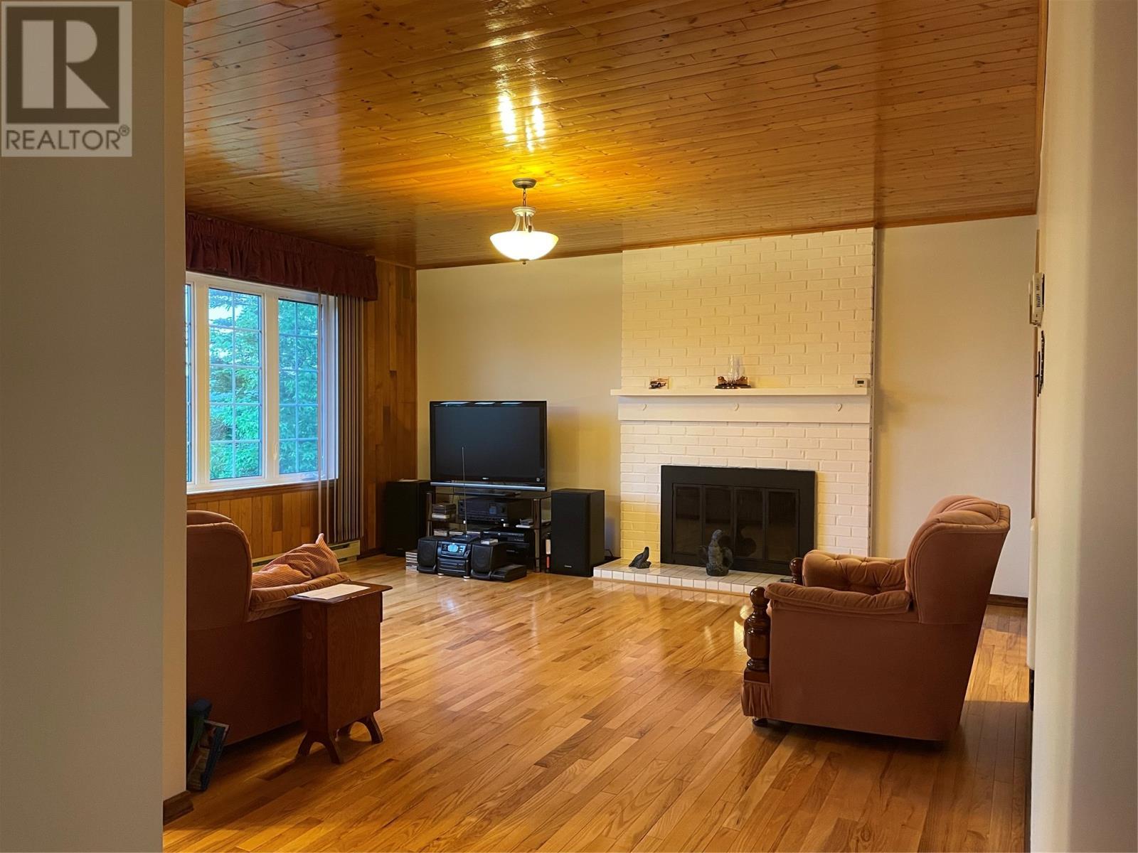 14 Juniper Road, St Anthony, NL - Indoor Photo Showing Living Room With Fireplace