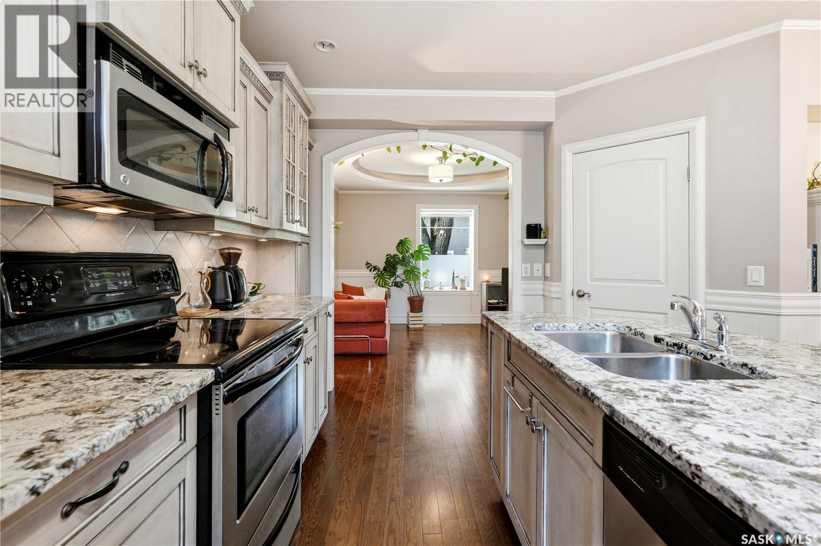 719 14Th Street E, Saskatoon, SK - Indoor Photo Showing Kitchen With Stainless Steel Kitchen With Double Sink