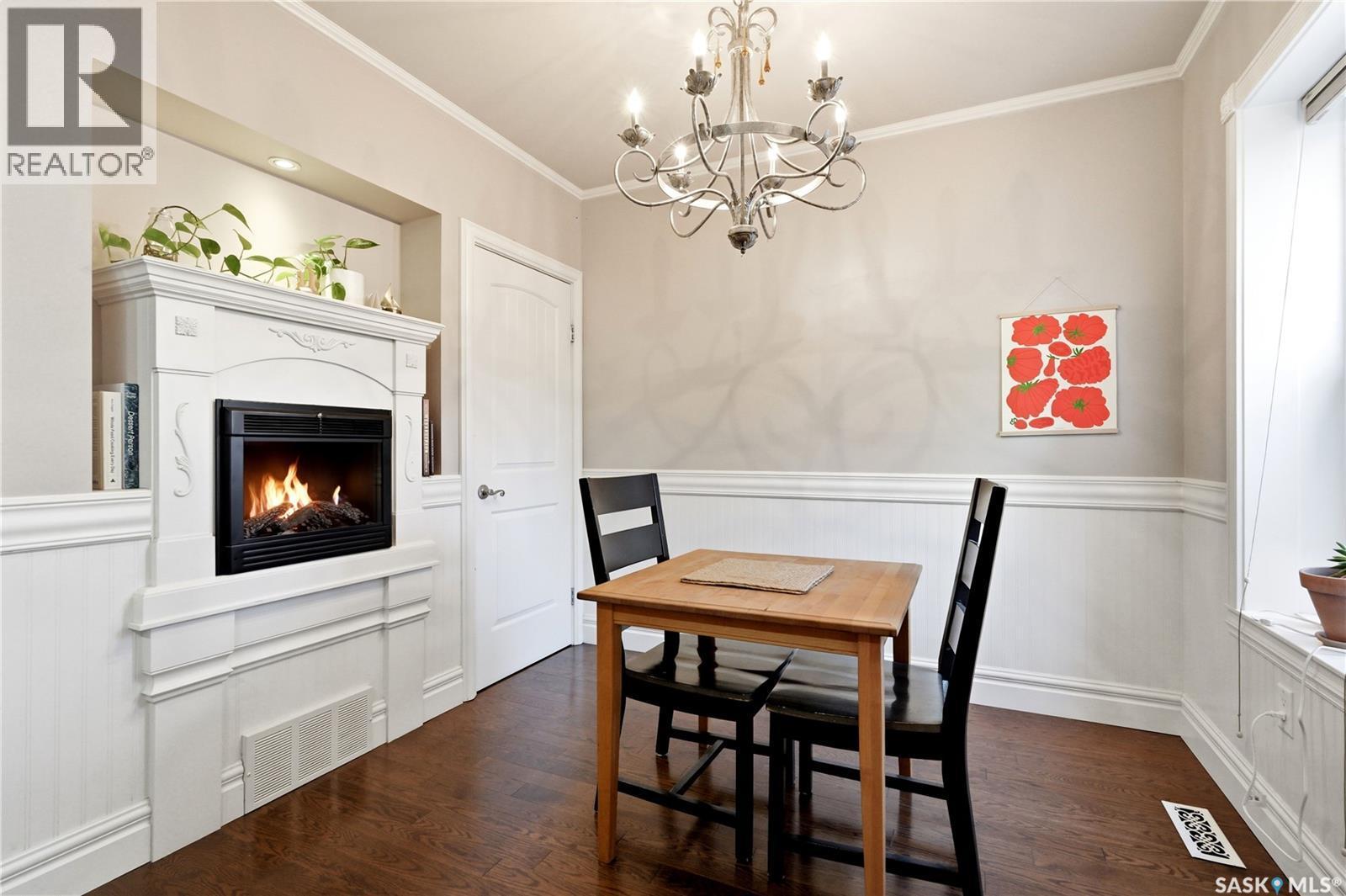 719 14Th Street E, Saskatoon, SK - Indoor Photo Showing Dining Room With Fireplace