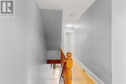 Upper landing showcasing original bannister -