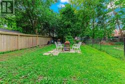 Deep, deep fenced rear yard - outdoor fireplace -