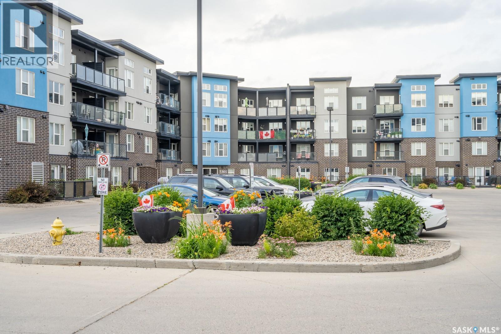 404 5301 Universal Crescent, Regina, SK - Outdoor With Balcony With Facade
