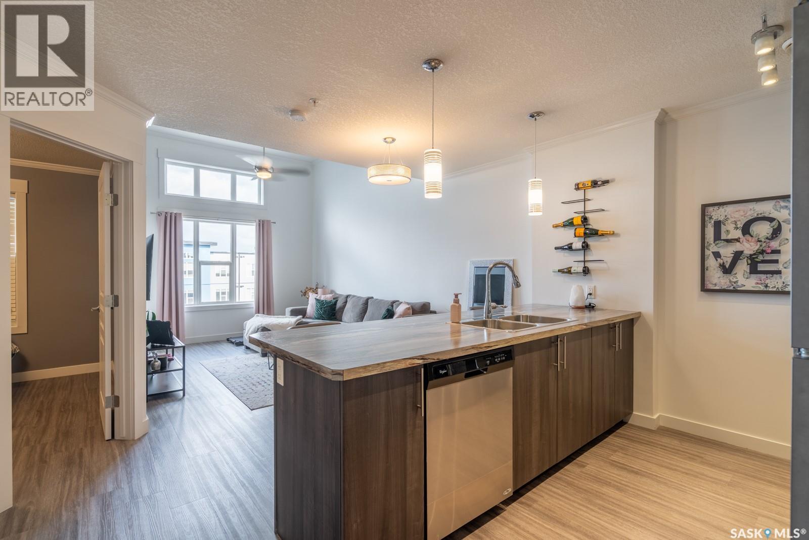 404 5301 Universal Crescent, Regina, SK - Indoor Photo Showing Kitchen With Double Sink
