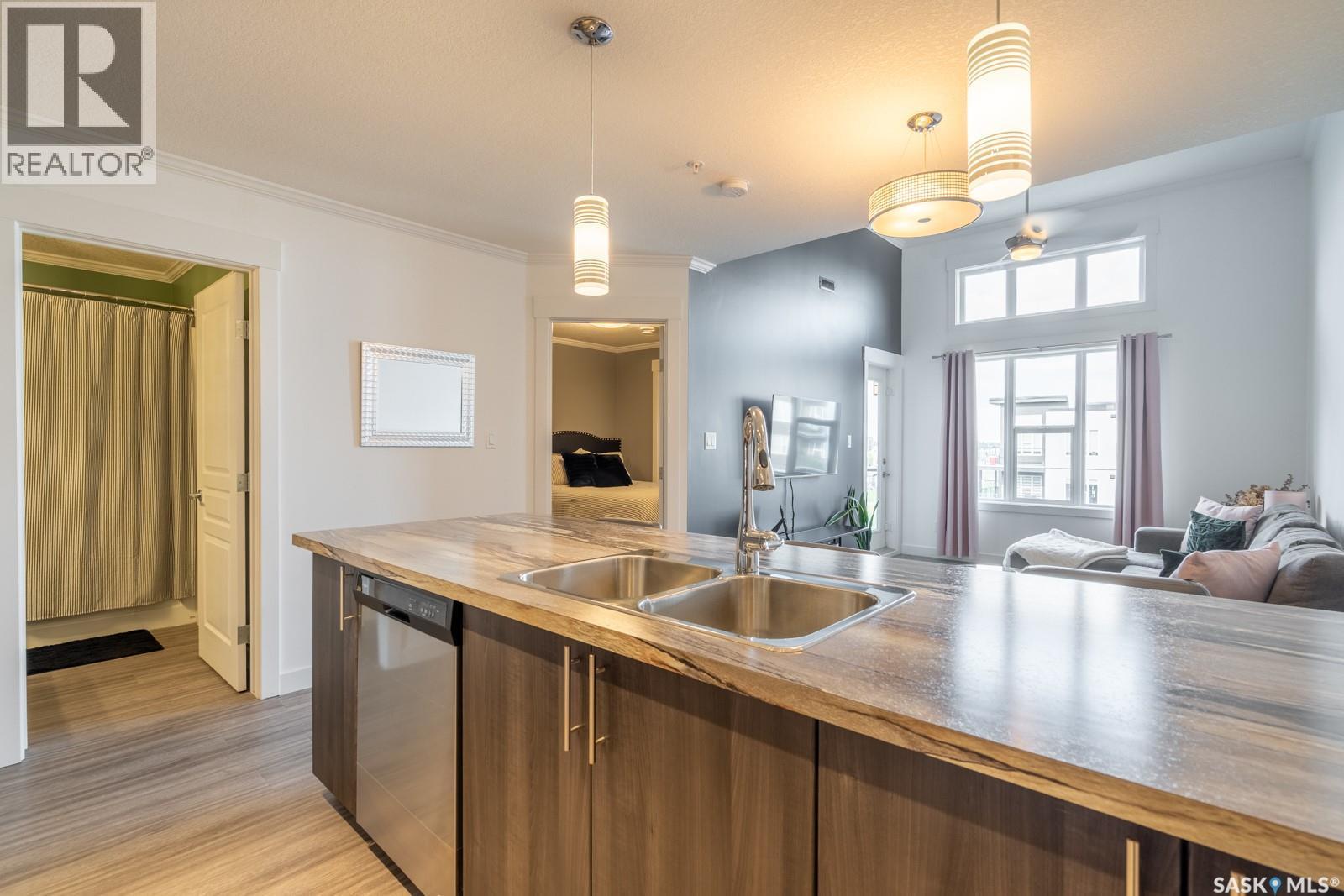 404 5301 Universal Crescent, Regina, SK - Indoor Photo Showing Kitchen With Double Sink