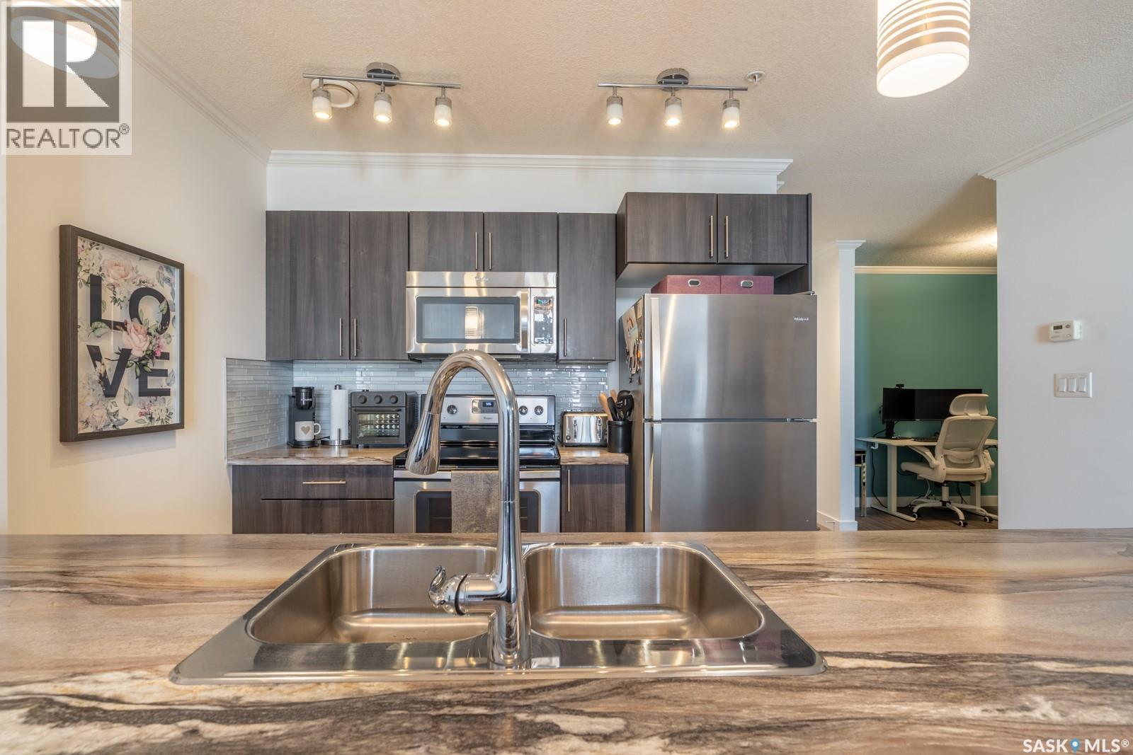 404 5301 Universal Crescent, Regina, SK - Indoor Photo Showing Kitchen With Stainless Steel Kitchen With Double Sink