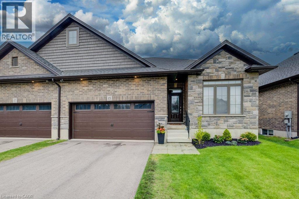 Stone and brick facade with a prominent front entrance - 15 Matheson Crescent, Innerkip, ON - Outdoor With Facade