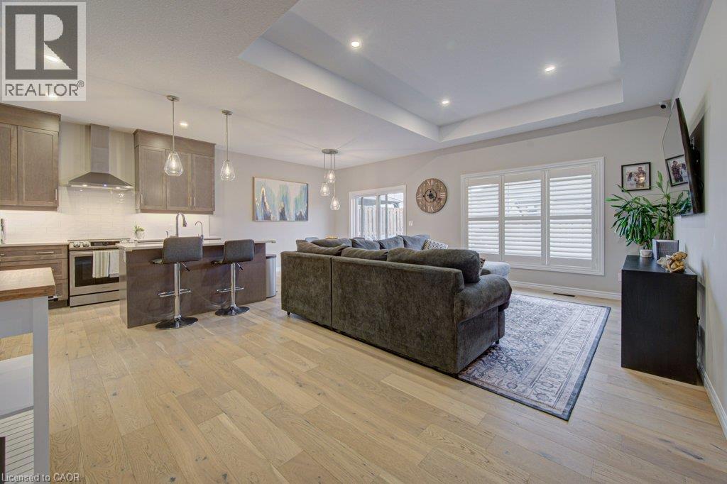 Open-concept main living area with wide plank wood-finish flooring - 15 Matheson Crescent, Innerkip, ON - Indoor