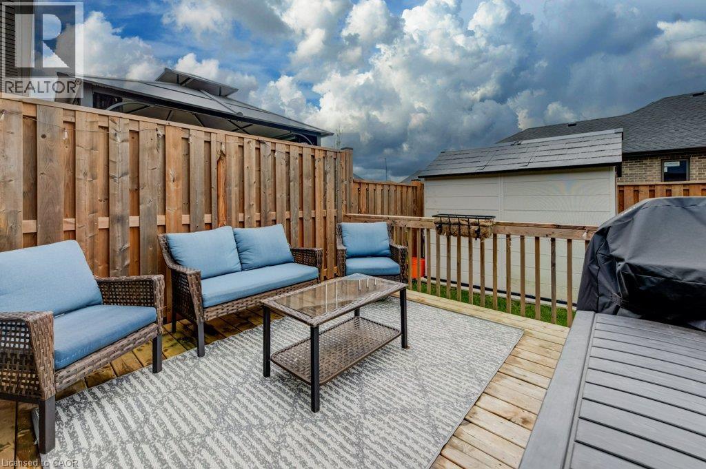 Expansive wood deck with a privacy fence - 15 Matheson Crescent, Innerkip, ON - Outdoor With Deck Patio Veranda With Exterior