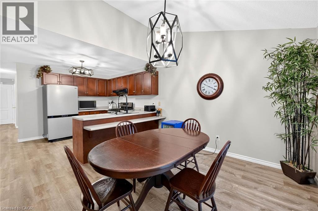Open concept dining area with wood-finish flooring - 43 Liam Drive, Ancaster, ON - Indoor Photo Showing Dining Room
