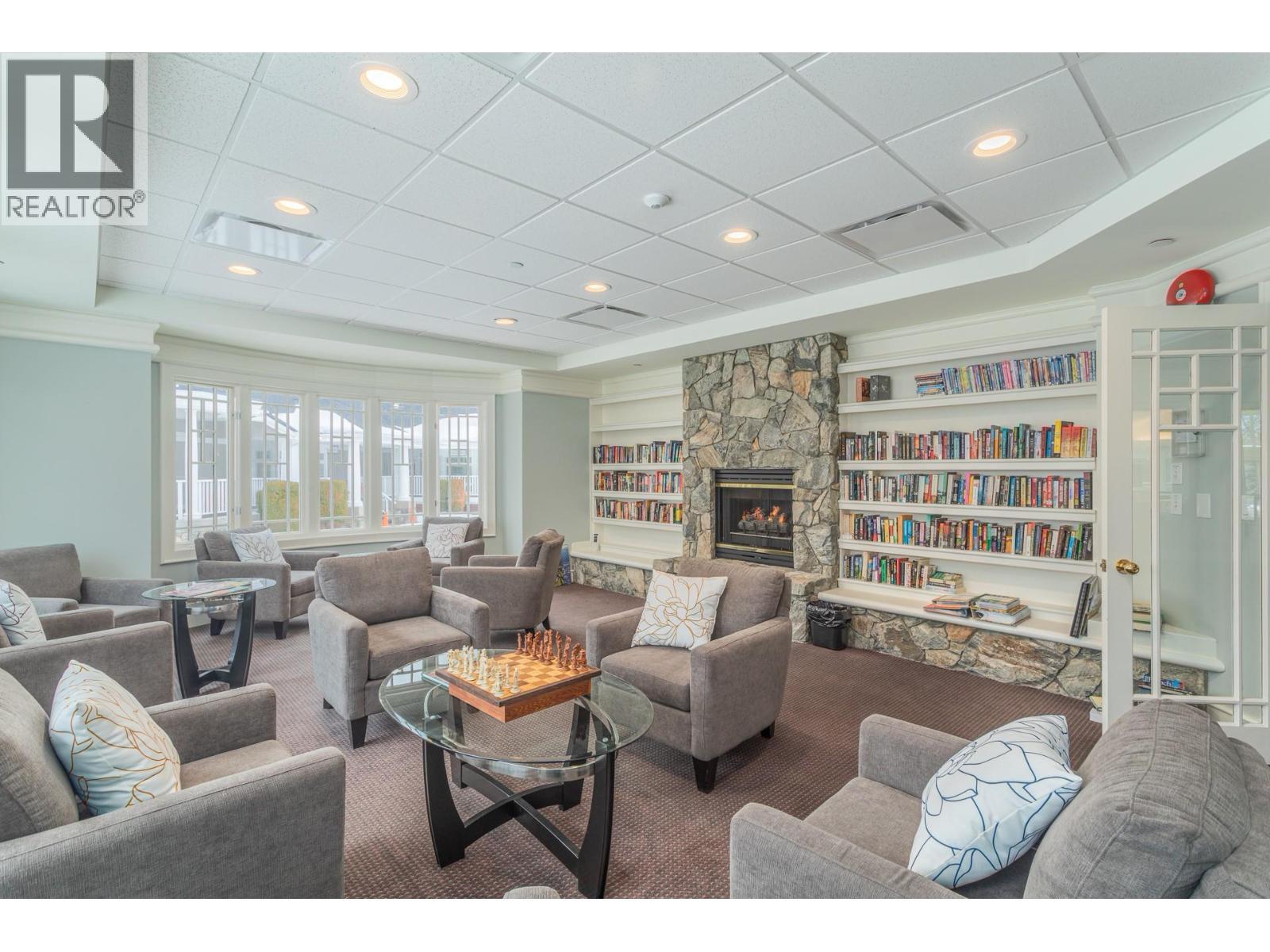 4122 Gallaghers Boulevard S, Kelowna, BC - Indoor Photo Showing Living Room With Fireplace