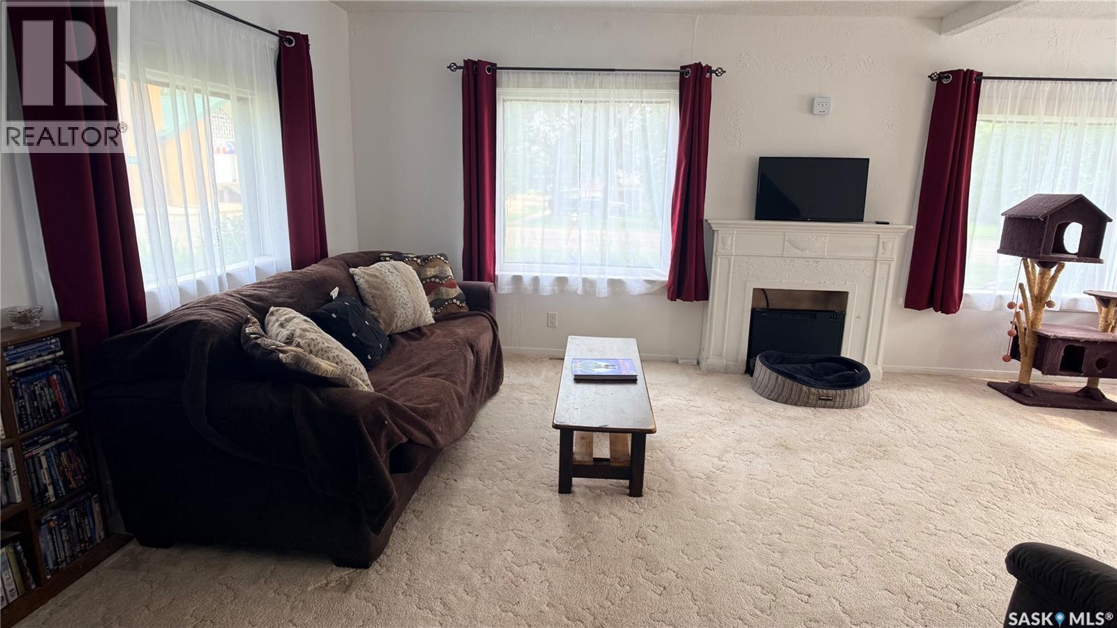 402 Saskatchewan Avenue, Torquay, SK - Indoor Photo Showing Other Room With Fireplace