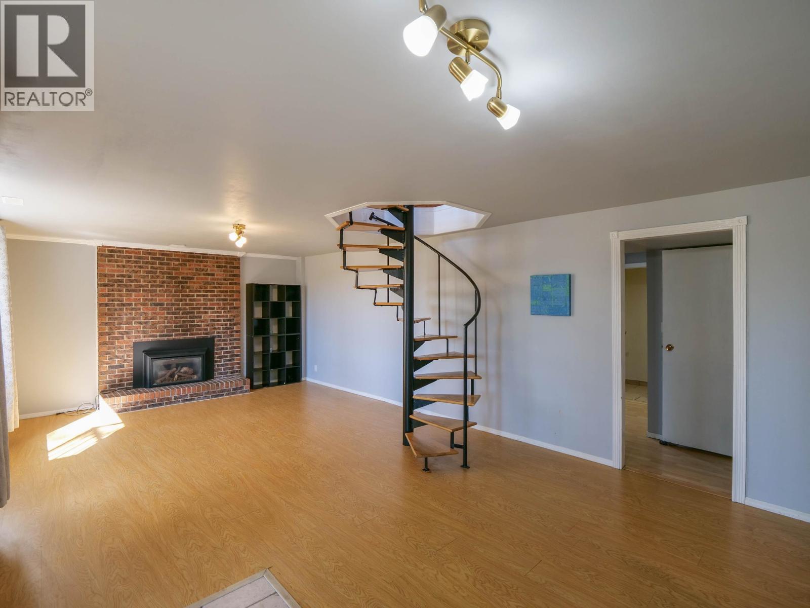 182 S Coach Road, Quesnel, BC - Indoor Photo Showing Other Room With Fireplace