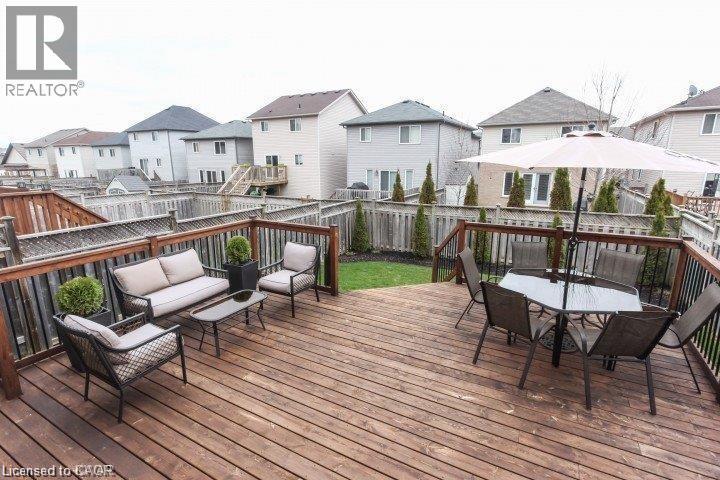 Expansive wood deck with dark wood railing and black balusters - Upper-313 Featherstone Crescent, Kitchener, ON - Outdoor With Deck Patio Veranda With Exterior