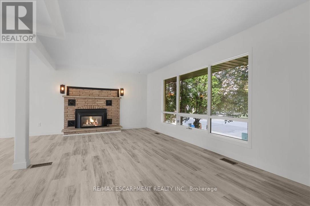 345 Berkindale Drive, Hamilton, ON - Indoor Photo Showing Living Room With Fireplace