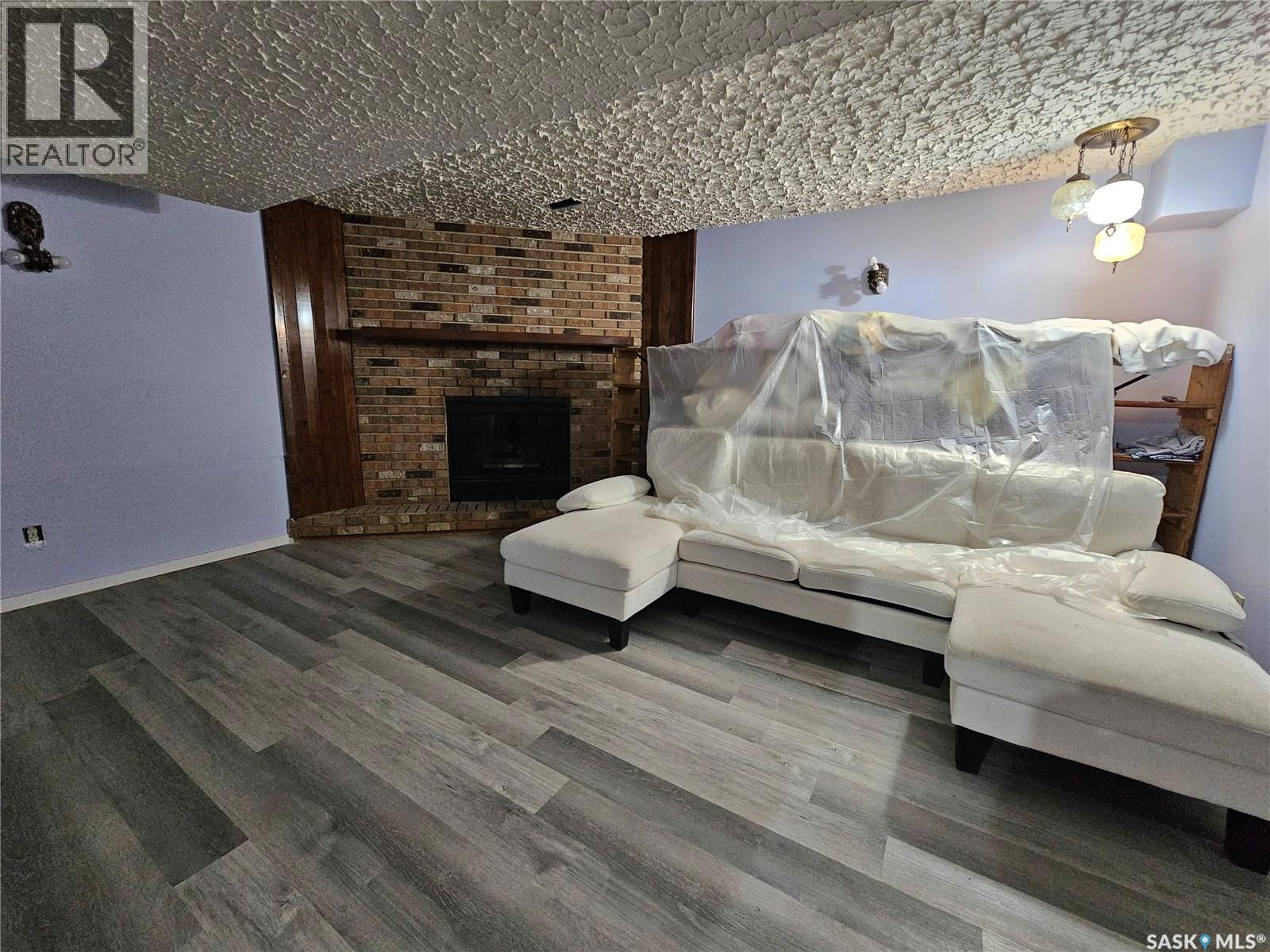 1641 103Rd Street, North Battleford, SK - Indoor Photo Showing Living Room With Fireplace