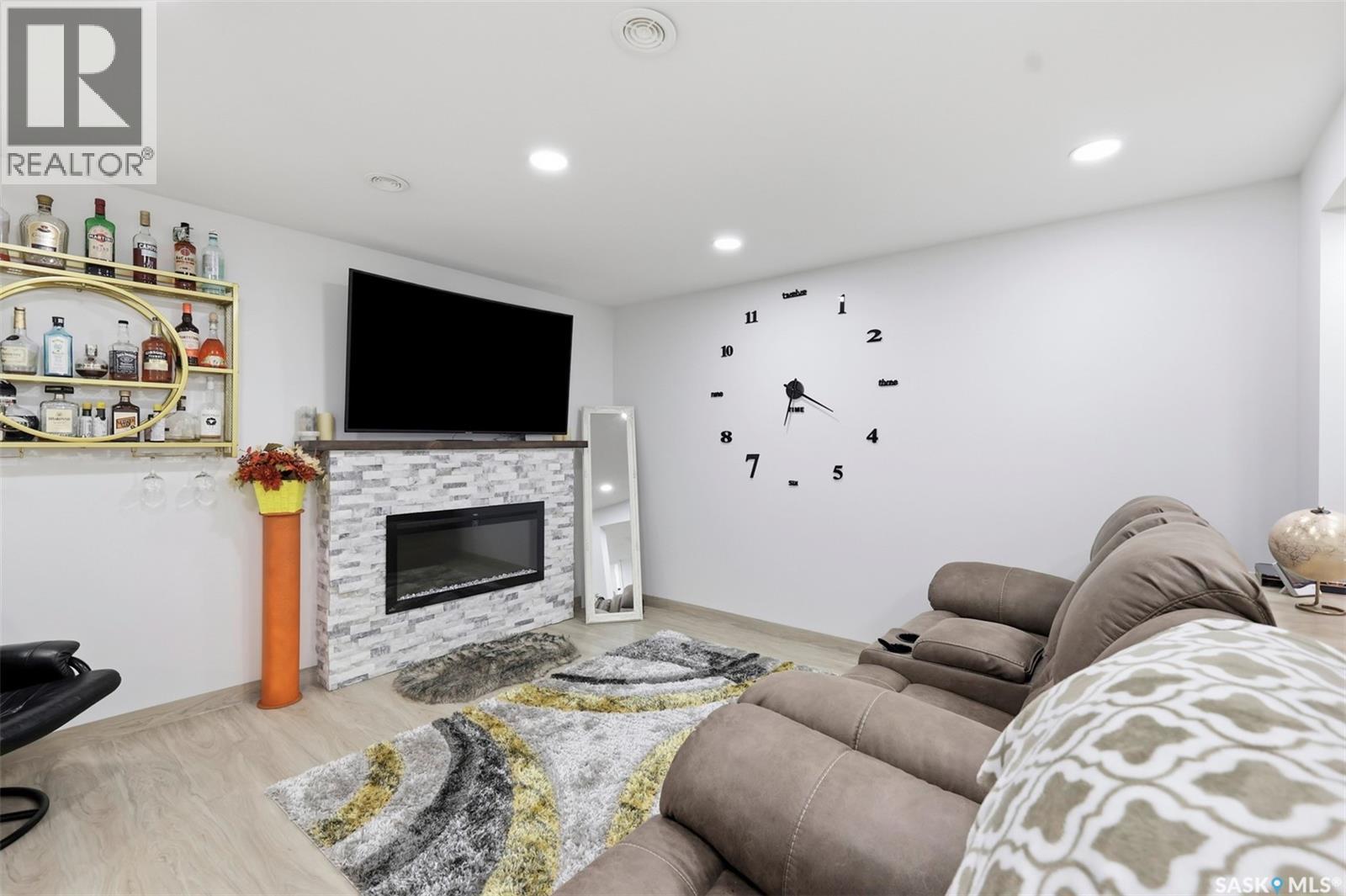 503 Maple Crescent, Warman, SK - Indoor Photo Showing Living Room With Fireplace