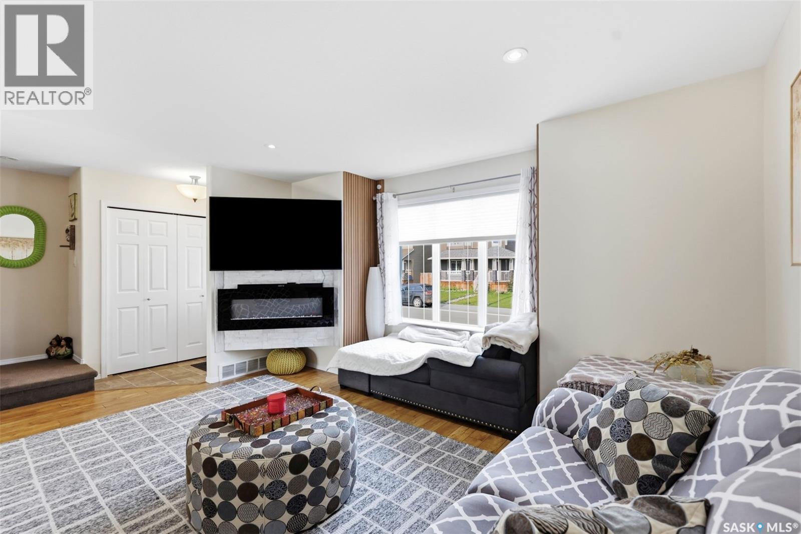 503 Maple Crescent, Warman, SK - Indoor Photo Showing Living Room With Fireplace
