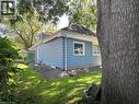 Blue siding exterior with white trim and white-framed windows - 9 Norfolk Street N, Hamilton, ON  - Outdoor 