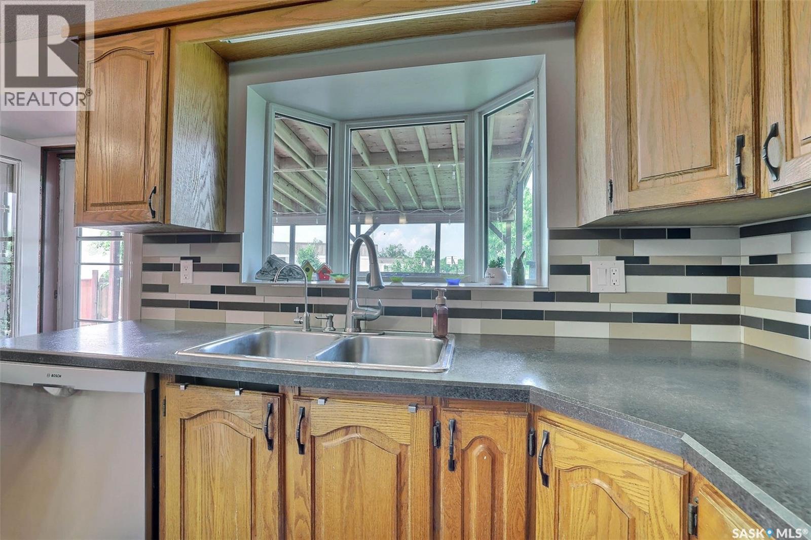 3419 Keehr Place E, Regina, SK - Indoor Photo Showing Kitchen With Double Sink