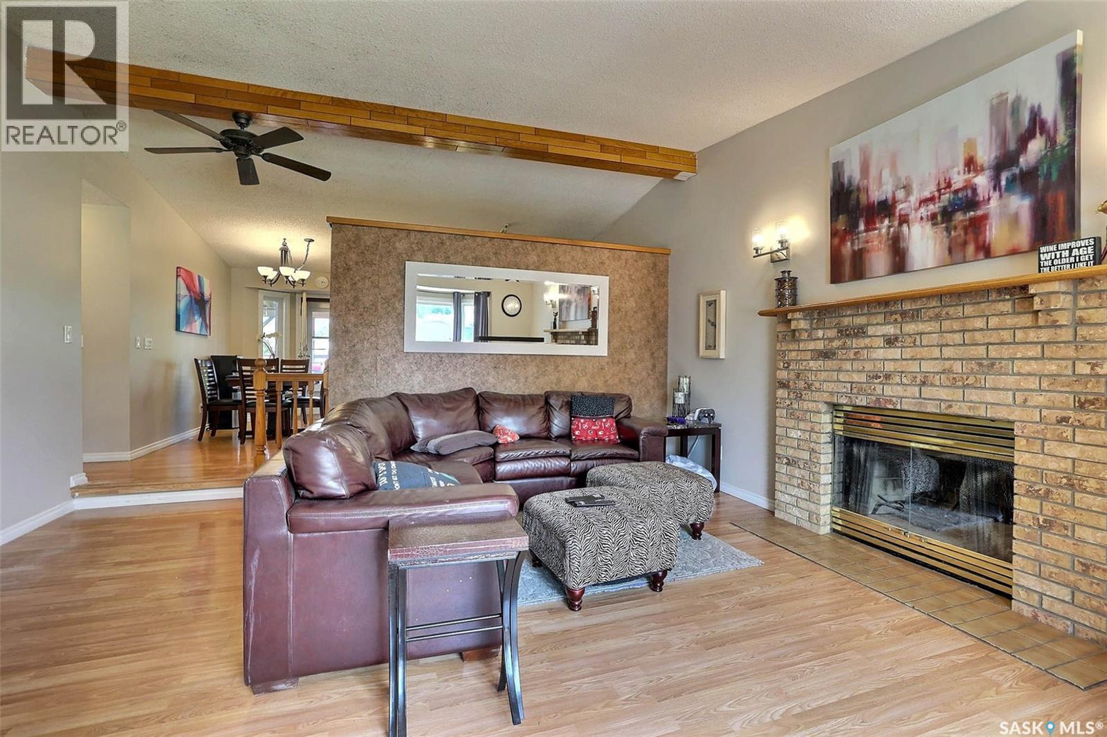 3419 Keehr Place E, Regina, SK - Indoor Photo Showing Living Room With Fireplace