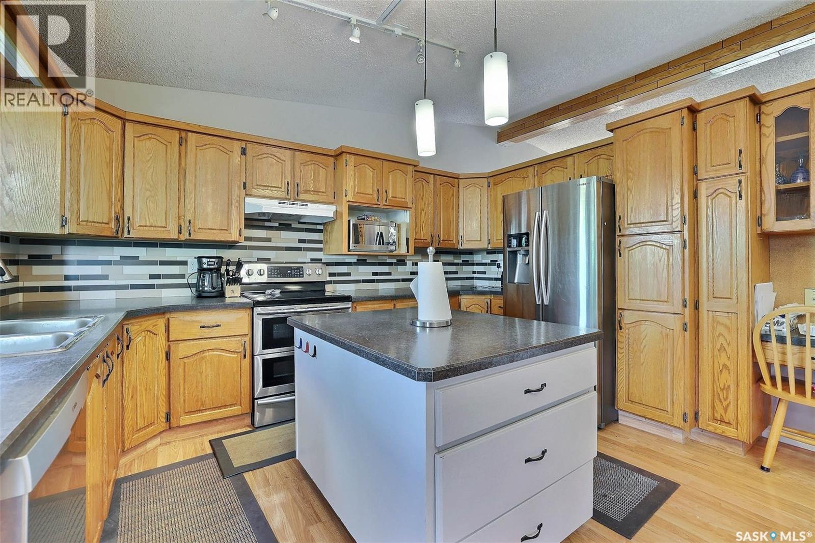 3419 Keehr Place E, Regina, SK - Indoor Photo Showing Kitchen With Double Sink