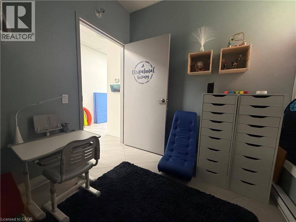Interior room with light blue-grey walls and light-toned tile flooring - 51 Benton Street, Kitchener, ON