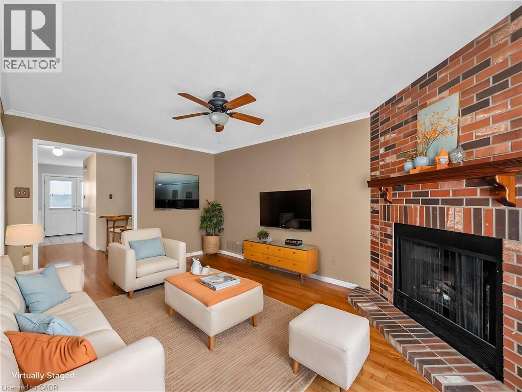 Virtually Staged - 60 Attwood Drive, Cambridge, ON - Indoor Photo Showing Living Room With Fireplace
