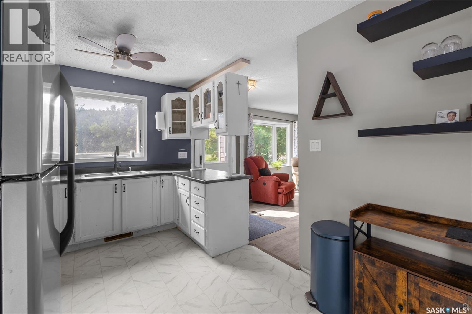 209 Macdowall Crescent, Prince Albert, SK - Indoor Photo Showing Kitchen With Double Sink